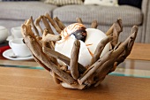 Bowl made from root wood as artistic natural ornament in relaxed ambiance