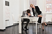 Business people laughing in office