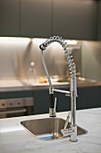 Faucet with pull out spout on a marble countertop