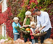 Family picking seasonal vegetables