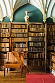 Antique library with library ladder and ecclesiastical, Gothic vaulted ceiling