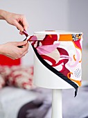 Decorating a white table lamp in 70s colours with a scarf