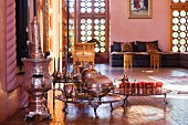 Antique silver tea set and floor trays in a salon marocain