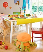 Dining table with muffins and orange juice in a playroom