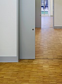 Rooms with parquet flooring throughout and a view through open sliding doors (Goethe Institut, London)