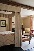 Four poster bed in home of fabric designer Richard Smith in East Sussex