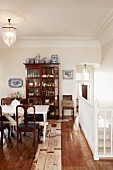 View of dining area with antique display case and vintage-style wooden floor