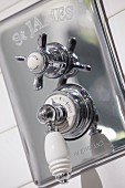 Temperature control with china handle and tap on chrome wall-mounted fitting