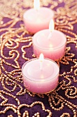 Pink tealights on luxury beaded tablecloth