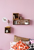 Box shelves with patterned back walls can be hand-crafted using wallpaper offcuts or painted