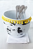 Mickey Mouse bowls decorated with yellow pompom trim