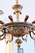 Traditional Hanging lamp made of carved wood with gold plated animal and plant motifs
