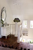 White-painted chest of drawers on top landing in Scandinavian house