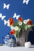Vase of tulips, teapots and butterfly wall stickers