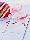 Christmas bauble on calendar