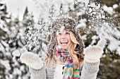USA, Utah, Salt Lake City, young woman playing in snow