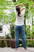 Woman doing relaxation exercises on terrace