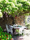 Set table under wisteria