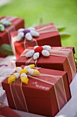 Boxes of chocolates with crocheted flowers for wedding guests