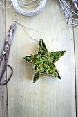 Star-shaped cookie cutters filled with moss