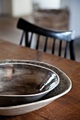 Ceramic dishes in shades of brown on wooden table