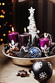 Bowl with candles and Christmas decorations