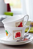 Teacups decorated with floral postage stamps