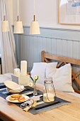 Hand-sewn runner on set breakfast table in rustic dining room