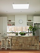Kitchen island with stainless steel worksurface and base unit with stone facing in white, country-house kitchen