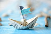 Paper boat with name on flag as place card
