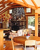 Country house style living room with table couch and fireplace