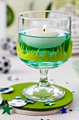 A floating candle and football decorations