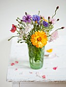 Summery posy in drinking glass