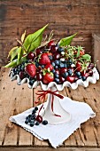 Dish of berries on wooden table
