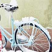 A bicycle covered with ice