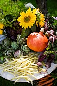 Summer vegetables and flowers on garden table (close-up)
