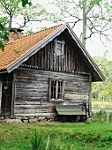 Old wooden cabin and bench