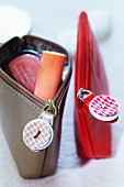 Make-up bags with zips decorated with buttons