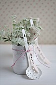 Chervil flowers & name tag in tin can covered with decorative paper