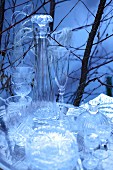 Still-life arrangement of antique crystal vessels outdoors in wintery atmosphere