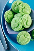 Green sweets with reliefs of apples