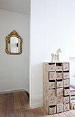 Shabby chic style chest of drawers, staircase and antique wall mirror
