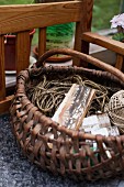 String and ball of yarn in wicker basket