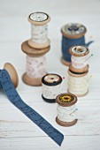 Vintage arrangement of printed ribbons on wooden reels