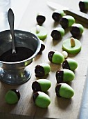 Green marzipan acorns with chocolate cups