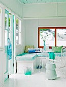Corner bench and white table in corner of bright room in white and mint green