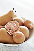 Bowl of fruit and fabric flower