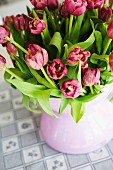 Bouquet of pink tulips in china vase