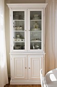 White, country-house-style, glass-fronted dresser