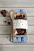 Chocolate cake and kitchen utensils wrapped as gift